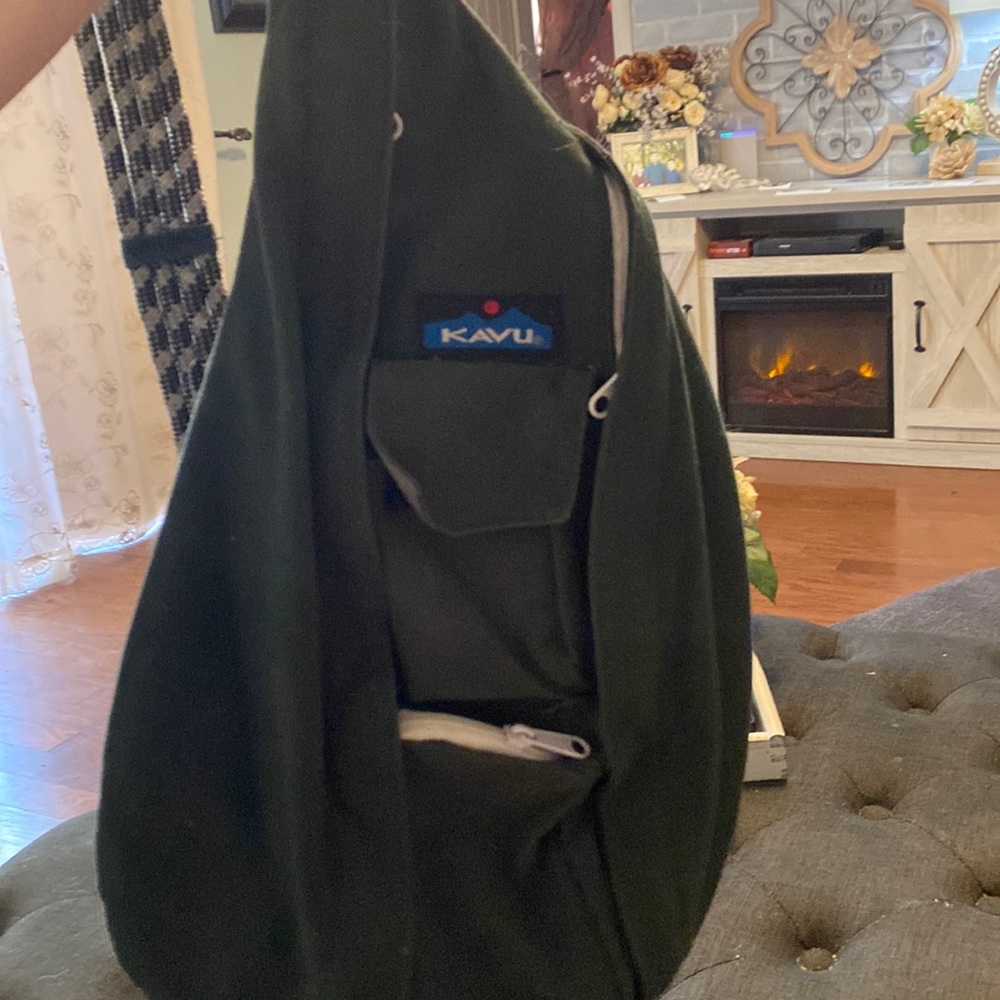 Kavu dark green sling rope backpack with white zippers